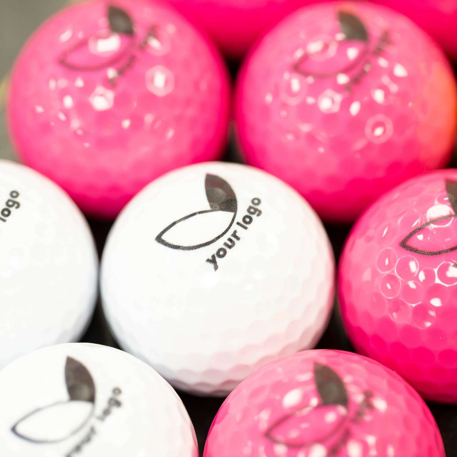 pink and white branded balls with 'your logo'