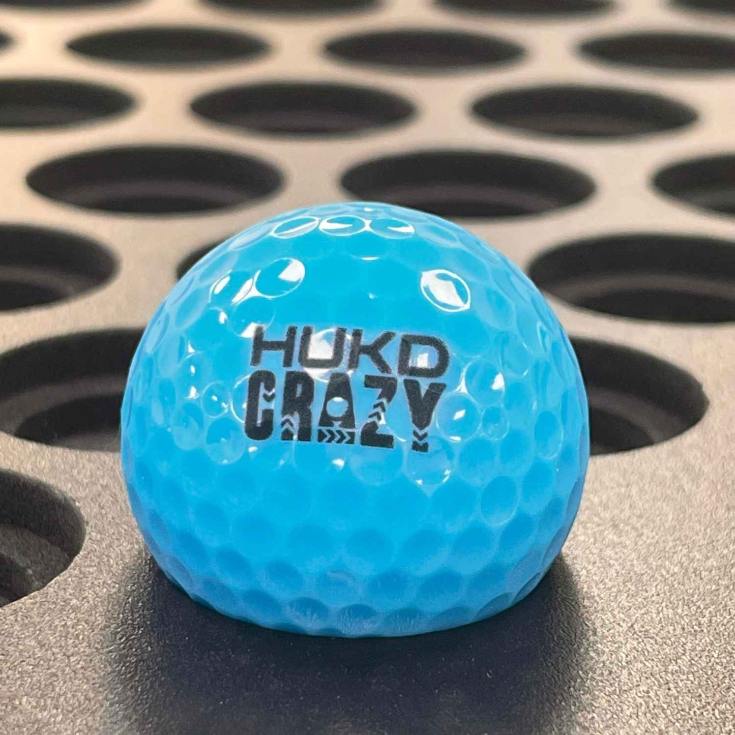 HUKD crazy golf branded ball with logo in blue