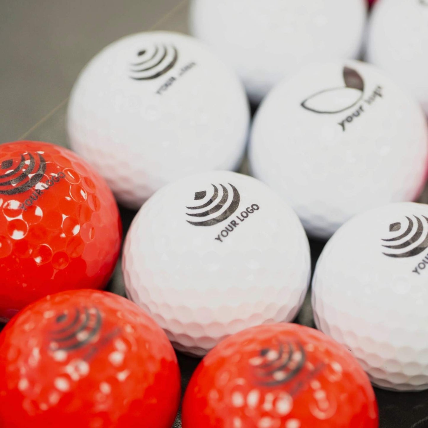 red and white 'your logo' branded balls