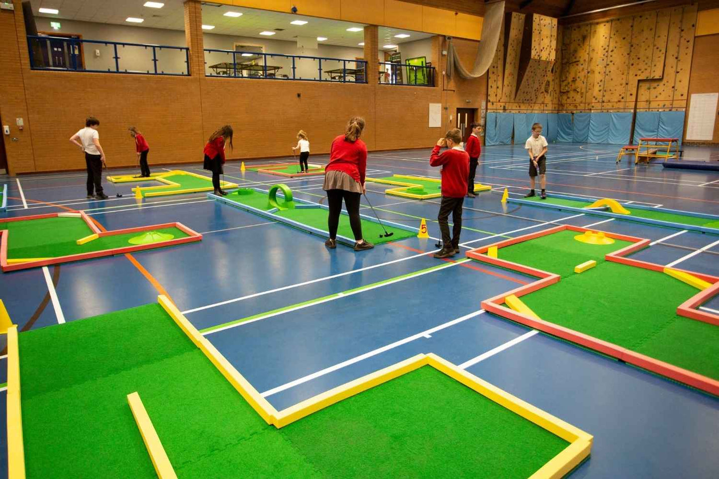school children playing on monstersize course