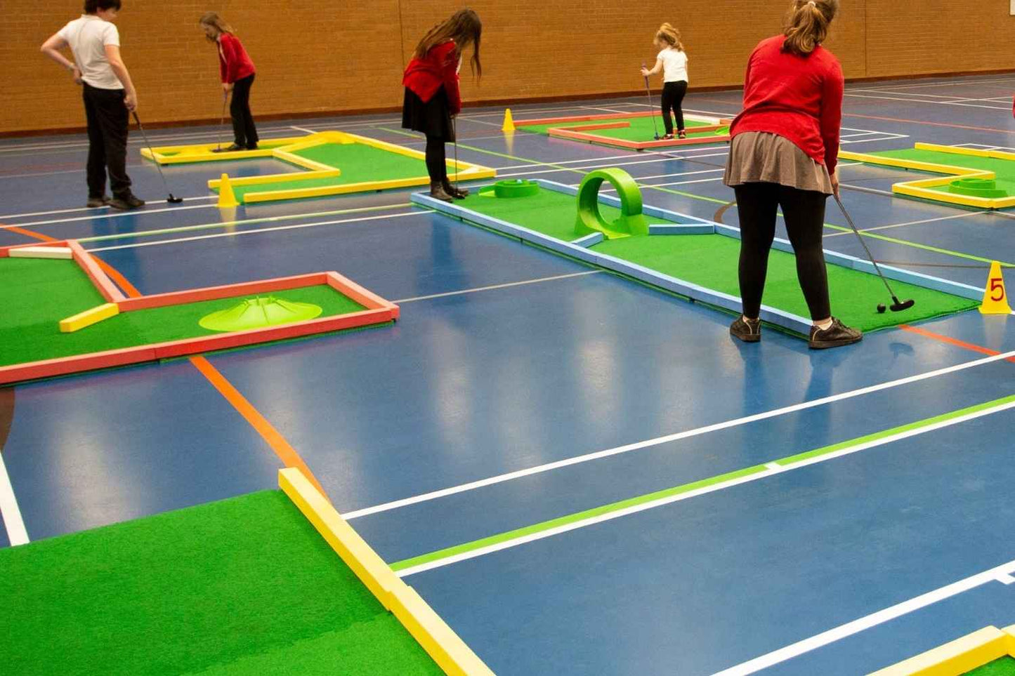 children playing on monstersize mini golf course