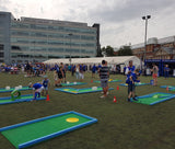 monstersize mini golf course being played by children in PE outdoors