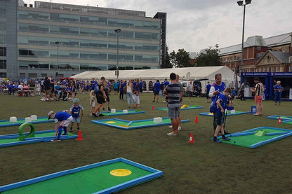 monstersize mini golf course being played by children in PE outdoors
