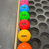 Absolut vodka branded mini golf balls in assorted bright colours