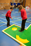 school children playing schools bitesize mini golf course