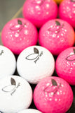 white and pink branded mini golf balls with 'your logo' sample design