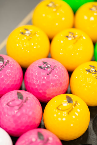 pink and yellow 'your logo' design balls